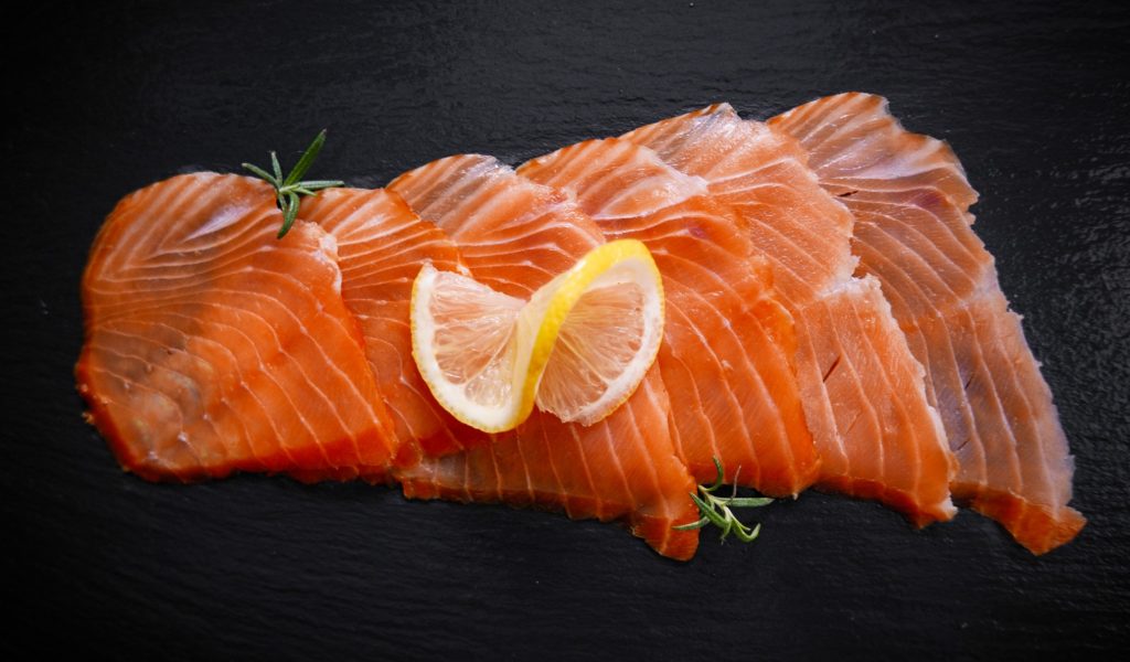smoked-salmon-with-lemon-and-rosemary-on-a-black-background-food-healthy-food-diet-healthy-diet-fish_t20_2wmVpP